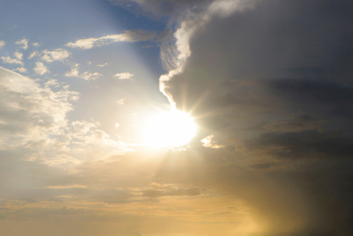 Sun peeking through clouds